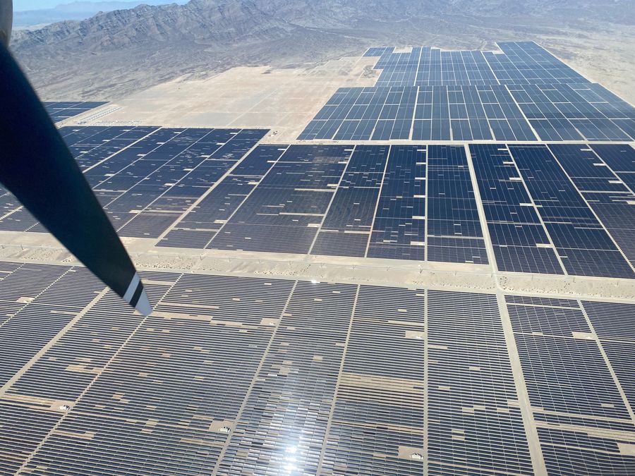 Aerial view of utility-scale solar farm from aircraft