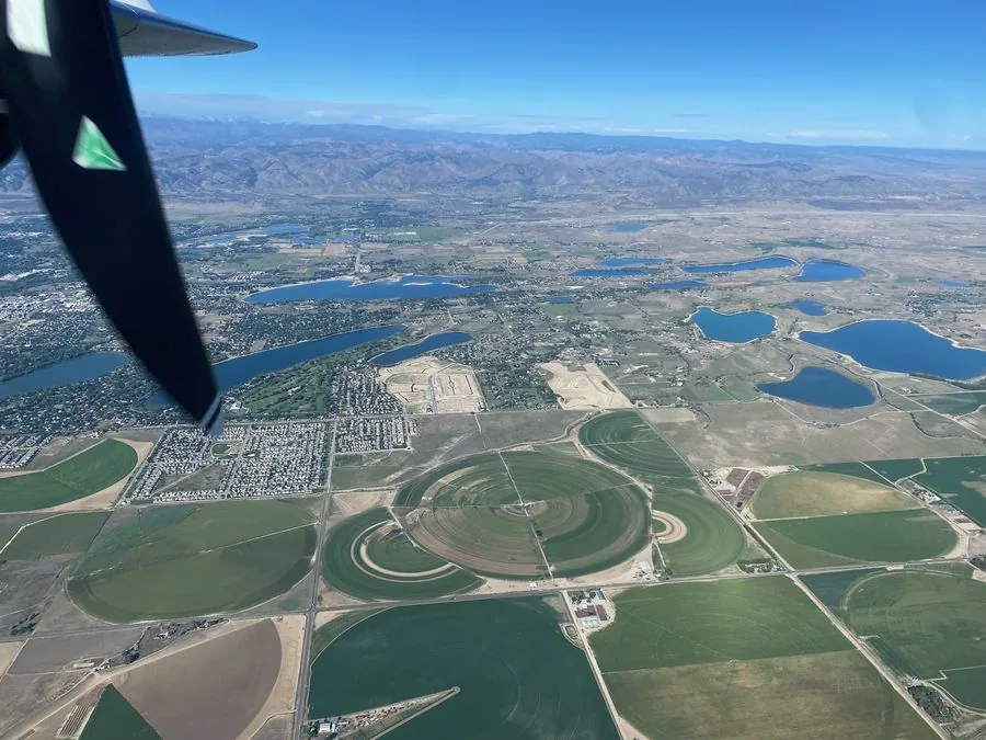 Aerial view of land development area with irrigation circles